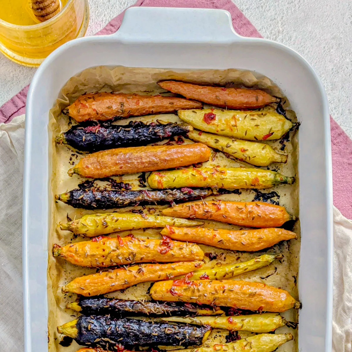 Harissa carrots in a baking dish.